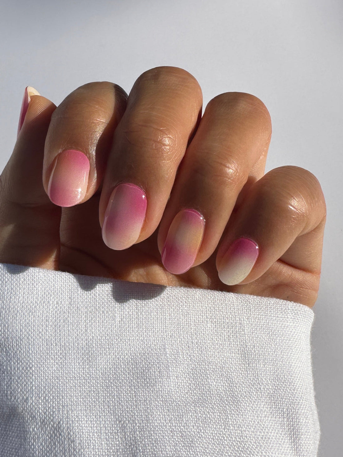 Semicured gel stickers with a sorbet design featuring swirls of pink, orange, and white colors.